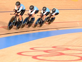 Canada's Allison Beveridge, Canada's Jasmin Duehring, Canada's Annie Foreman-Mackey and Canada's Georgia Simmerling compete in the women's track cycling team pursuit qualifying event.