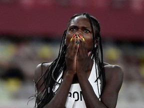 Namibia's Christine Mboma reacts after finishing in second place in the women's 200m semi-finals during the Tokyo 2020 Olympic Games.