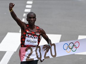 Kenya's Eliud Kipchoge crosses the finish line to win his second Olympic marathon at the 2020 Olympic Games.