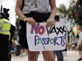 A woman protests against vaccine passports in London, England, on July 19, 2021.