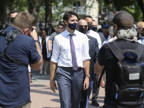 Justin Trudeau, Canada's prime minister, departs from a news conference in Montreal, Quebec, Canada, on Thursday, Aug. 5, 2021. Trudeau will likely call a snap election for September as the pandemic has turned into an opportunity for him to slay a very personal dragon: appear less movie star and more ship captain.