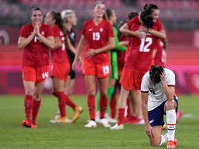 United States' Carli Lloyd reacts after being defeated 1-0 by Canada during a women's semifinal soccer match at the 2020 Summer Olympics.