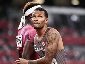 Canada's Andre De Grasse (R) reacts after competing in the men's 200m semi-finals during the Tokyo 2020 Olympic Games.