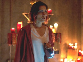 "This is insane!" Carly Pope in a scene from Demonic.