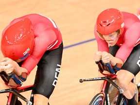 There was a storm brewing at the Izu Velodrome on Tuesday after the Denmark team were accused of bending the rules with riders seen wearing identical medical tape on their shins (pictured on the right) during the men's Olympic team pursuit event.