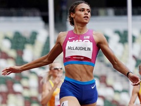 Gold medallist Sydney McLaughlin of the United States reacts.