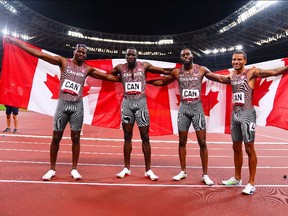 Aaron Brown, Jerome Blake, Brendon Rodney and Andre De Grasse of Canada celebrates after winning bronze in the men's 4x100m relay at the 2020 Tokyo Olympics.