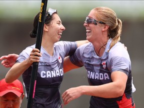 Tokyo 2020 Olympics - Canoe Sprint - Women's C2 500m - Final A - Sea Forest Waterway, Tokyo, Japan – August 7, 2021. Laurence Vincent-Lapointe of Canada and Katharine Vincent of Canada celebrate after winning bronze REUTERS/Yara Nardi