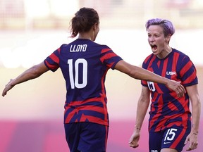 Megan Rapinoe of the United States celebrates scoring their second goal with Carli Lloyd in the bronze medal match against Australia at the 2020 Tokyo Olympics.