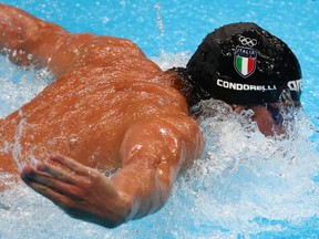 Santo Condorelli competes for Italy in the 100 metre butterfly at the 2020 Tokyo Olympics.
