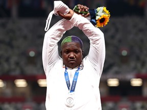 The International Olympic Committee is looking into the gesture U.S. athlete Raven Saunders made after the shot put silver medallist raised her arms in an X above her head, a potential breach of rules banning protests on medal podiums.