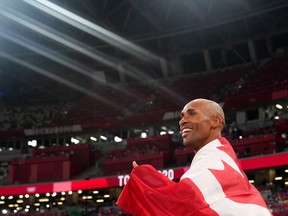 Damian Warner celebrates his Olympic decathlon victory.