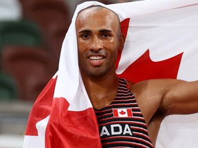 Damian Warner won the Olympic decathlon and broke a Games record with his 9,018 score.