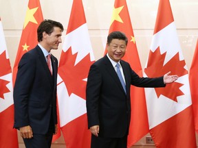 Chinese President Xi Jinping, right, gestures to Prime Minister Justin Trudeau ahead of their meeting at the Diaoyutai State Guesthouse in Beijing in 2016.