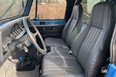The seats were reupholstered in gunmetal grey leather with blue piping to match the exterior colour.