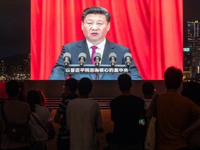 A screen shows Chinese President Xi Jinping speaking during a light show in Tamar Park in Hong Kong, China, on Thursday, July 1, 2021.