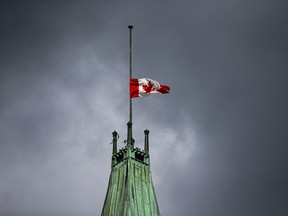 The Canadian flag at half mast above the Peace Tower on Parliament Hill, Monday, September 13, 2021.