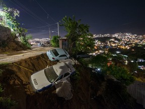 Cars slid off a roadside during the 9:00 p.m. earthquake. The epicenter was located about nine kilometres southeast of Acapulco.