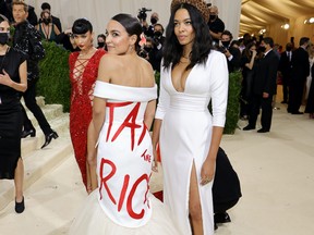 Alexandria Ocasio-Cortez and Aurora James attend The 2021 Met Gala Celebrating In America: A Lexicon Of Fashion at Metropolitan Museum of Art on September 13, 2021 in New York City.