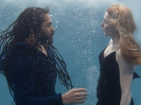 Luke Robinson and Fiona Graham, under the waves in Between Waves.