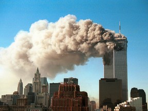 Smoke pours from the twin towers of the World Trade Center after they were hit by two hijacked airliners in a terrorist attack on New York City on Sept. 11, 2001.