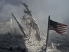 An American flag flies near the base of the destroyed World Trade Center in New York, on September 11, 2001.