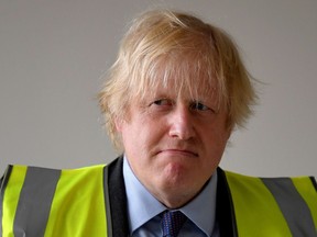 Prime Minister Boris Johnson visits a science room under construction at Ealing Fields High School in west London in June 2020.