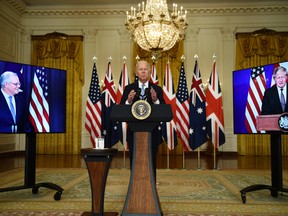 U.S. President Joe Biden participates in a virtual press conference on national security with British Prime Minister Boris Johnson, right, and Australian Prime Minister Scott Morrison, in the White House in Washington, D.C., on Sept. 15.