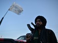 A Taliban fighter stands along a road in Herat, Afghanistan, on Sept. 19.