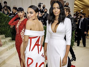 Alexandria Ocasio-Cortez (L) and Aurora James attend The 2021 Met Gala Celebrating In America: A Lexicon Of Fashion at Metropolitan Museum of Art on September 13, 2021 in New York City.