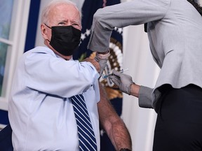 U.S. President Joe Biden receives a third dose of the Pfizer/BioNTech COVID-19 vaccine at the White House on Sept. 27, 2021. Biden's approval rating has fallen in the wake of a COVID resurgence and the debacle in Afghanistan, among other setbacks, writes Derek H. Burney.