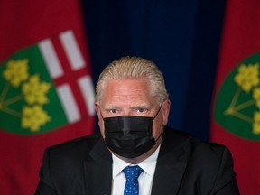 Ontario Premier Doug Ford during a media conference at Queen's Park announcing the enhanced COVID-19 vaccine certificate system. THE CANADIAN PRESS/ Tijana Martin