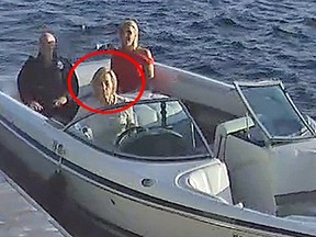 A screenshot taken from a security video shows Linda O'Leary, wife of celebrity investor Kevin O'Leary (rear left), driving their speedboat to a neighbour's cottage on the evening of a fatal boat crash. The O'Learys are with Allison Whiteside, a family friend.