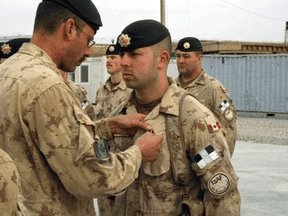 "It is still upsetting to think about, because you did have a connection there," Canadian veteran Matt Anderson (shown receiving pin) says of the collapse of Afghanistan's government to the Taliban.