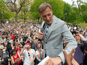 People's Party of Canada Leader Maxime Bernier prepares to speak at a protest against COVID-19 restrictions, in Toronto on May 15, 2021.