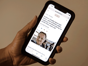 An image on a iPhone of Canadian Michael Spavor on the Global Times website with a headline stating source said Spavor took photos, videos of Chinese military equipment and sent them to Michael Kovrig and outside Canada. Peter J. Thompson, Postmedia