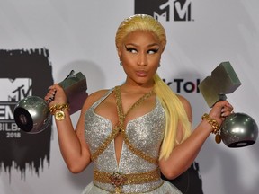 In this file photo taken on November 04, 2018 Trinidadian-US rapper Nicki Minaj poses backstage with her awards during the MTV Europe Music Awards at the Bizkaia Arena in the northern Spanish city of Bilbao.