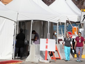 Health-care workers are seen outside the Rockyview General Hospital in Calgary on Sept. 28.
