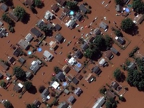 A satellite image shows houses along Boesel Avenue submerged in flood water in Manville, New Jersey.