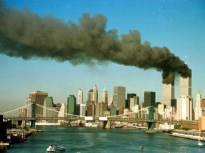 Smoke is seen at the towers of the World Trade Center shortly after being struck by a hijacked commercial aircraft, in New York, U.S., September 11, 2001.