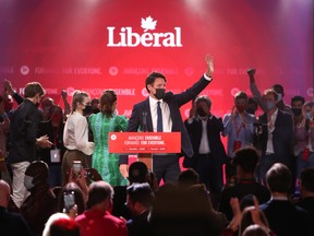 Justin Trudeau, Canada's prime minister, waves to supporters during a Liberal Party election night event in Montreal, Quebec, Canada, in the early hours of Tuesday, Sept. 21, 2021.