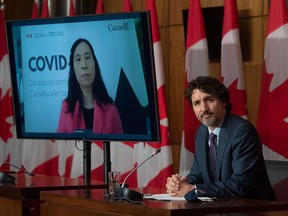Chief Public Health Officer Theresa Tam appears via video conference as Prime Minister Justin Trudeau attends a news conference about COVID-19, in Ottawa on May 4, 2021. Tam's medical advice has changed radically since the start of the pandemic, writes Rex Murphy.