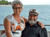 Peter and Sharon White-Robinson aboard Kahu, their former luxury yacht which was raided by British police.