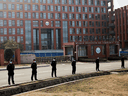 Security personnel keep watch outside the Wuhan Institute of Virology in China during a visit from a World Health Organization team looking into COVID origins.