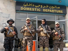 Taliban forces stand guard a day after the U.S. troops withdrawal from Hamid Karzai International Airport in Kabul, Afghanistan Aug. 31, 2021.