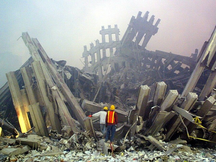  Rescue workers survey damage to the World Trade Center 11 September, 2001 in New York.