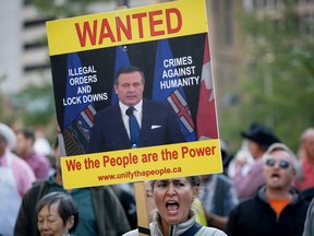 Alberta protesters shout slogans against Premier Jason Kenney during the Stampede in Calgary, Alta.,  in July. THE CANADIAN PRESS/Jeff McIntosh