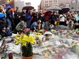 A group of people pay resprect at a memorial set up in Union Square in New York City on Friday, September 14/2001 which has been called a national day of mourning.