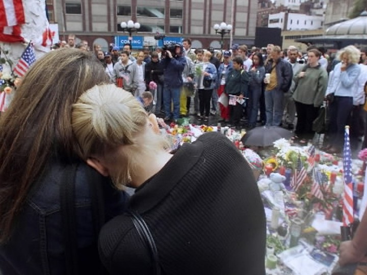  Two woman lean on each other at a memorial set up in Union Square in New York City on Friday, September 14/2001 which has been called a national day of mourning. Hundreds of Americans came to the site to pay tribute to those who died in Tuesday’s disaster.