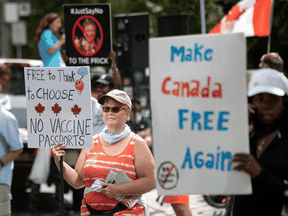 Protesters gather to demonstrate against measures taken by health authorities to curb the spread of COVID-19, in Toronto, Sept. 11, 2021.